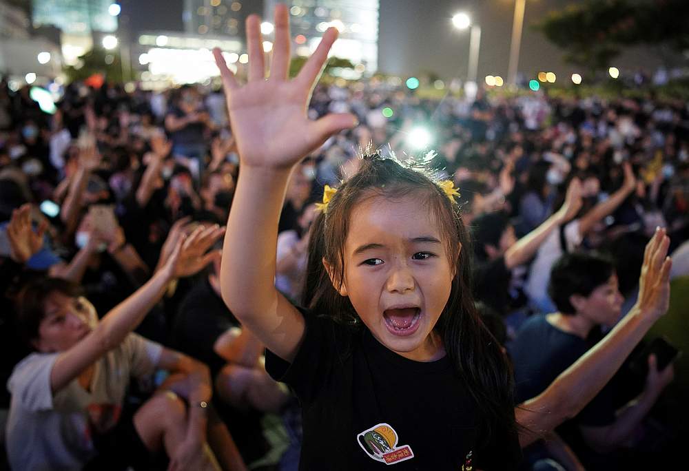 A girl raises her hand as anti-government protesters attend a rally at Edinburgh Place to show solidarity for arrested political activists in Hong Kong September 27, 2019. u00e2u20acu201d Reuters pic