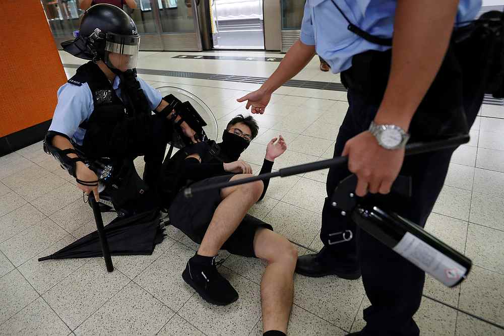 An anti-extradition bill protester is detained by a riot police officer during a protest, at Po Lam Mass Transit Railway (MTR) station, in Hong Kong September 5, 2019. u00e2u20acu201d Reuters pic
