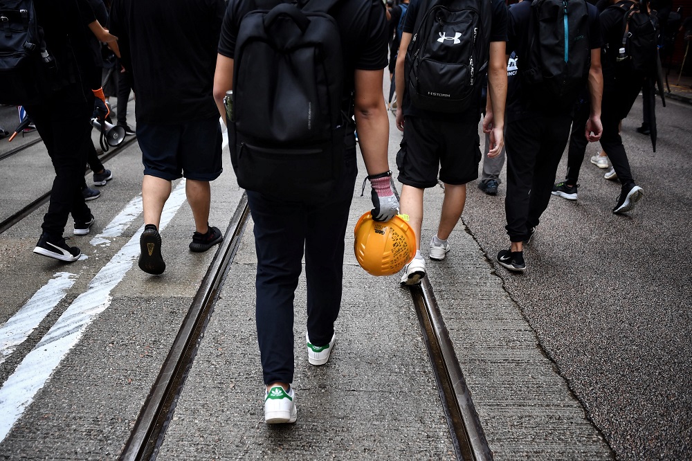 This photo taken on August 31, 2019 shows protester ‘Ryan’ marching with fellow protesters in Causeway Bay in Hong Kong. — AFP pic