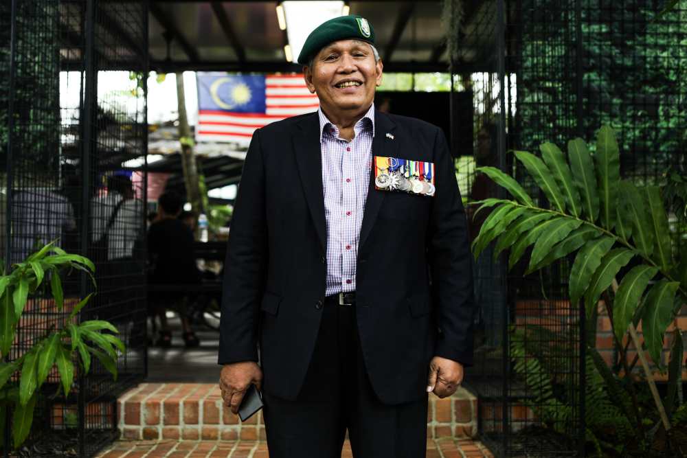 Zaini and his Seri Pahlawan Gagah Perkasa (silver crescent moon with red and yellow stripes) pinned to his chest. ― Picture by Ahmad Zamzahuri