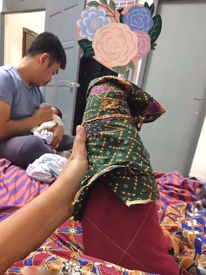 Siti's husband attending to her and the children before leaving for work. u00e2u20acu201d Picture via Facebook