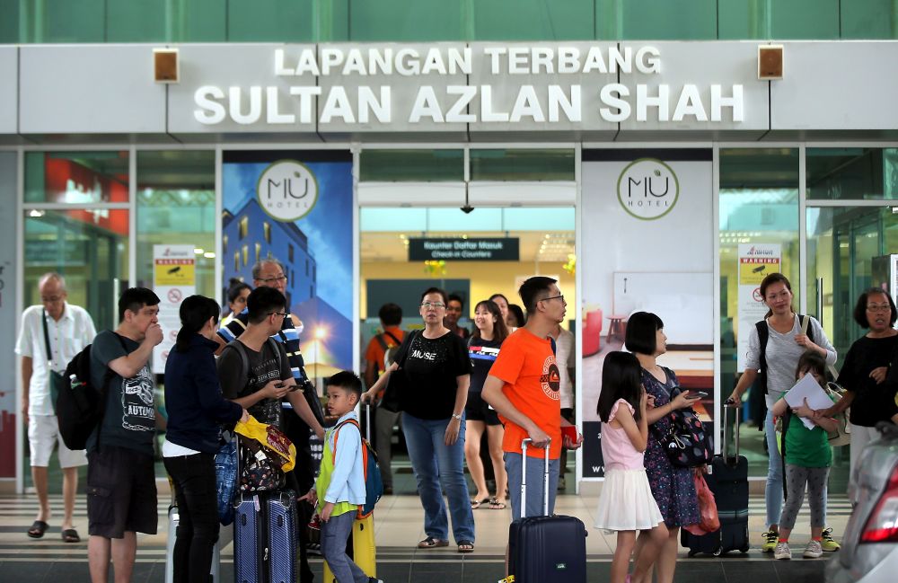 Passengers are seen at the entrance of the Sultan Azlan Shah Airport in Ipoh due to haze September 13, 2019. u00e2u20acu201d Picture by Farhan Najib
