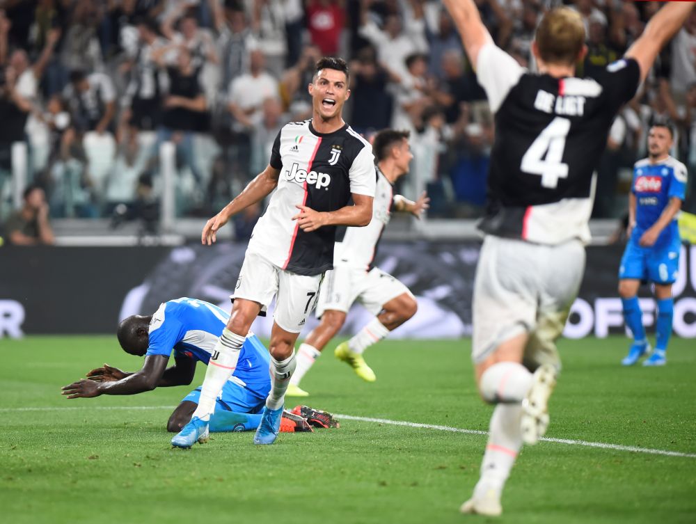 Napoli's Kalidou Koulibaly looks dejected after scoring an own goal and Juventus' fourth as Cristiano Ronaldo and Matthijs de Ligt celebrate. u00e2u20acu201d Reuters pic