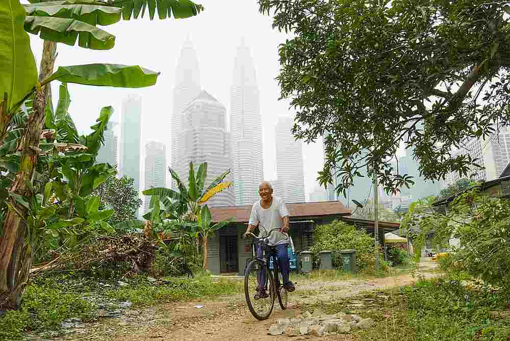 A resident cycles in Kampung Baru, Kuala Lumpur September 22, 2019. u00e2u20acu201d Picture by Ahmad Zamzahuri