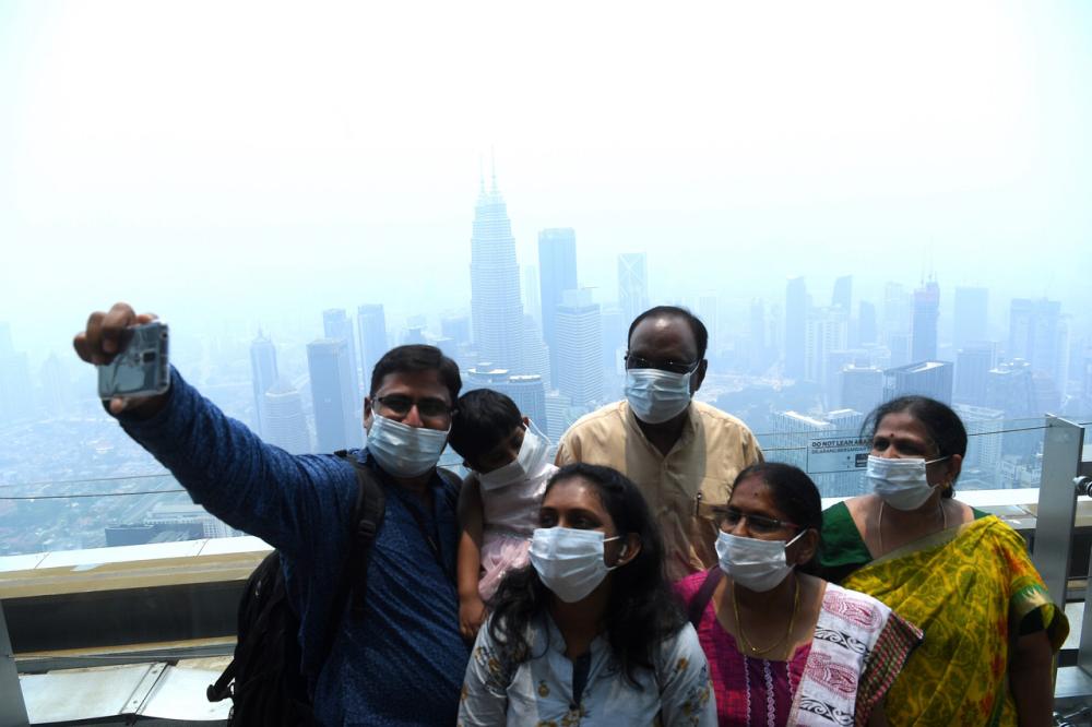 Tourists pose for a photo on the Sky Deck at the KL Tower in Kuala Lumpur September 12, 2019. u00e2u20acu2022 Bernama pic