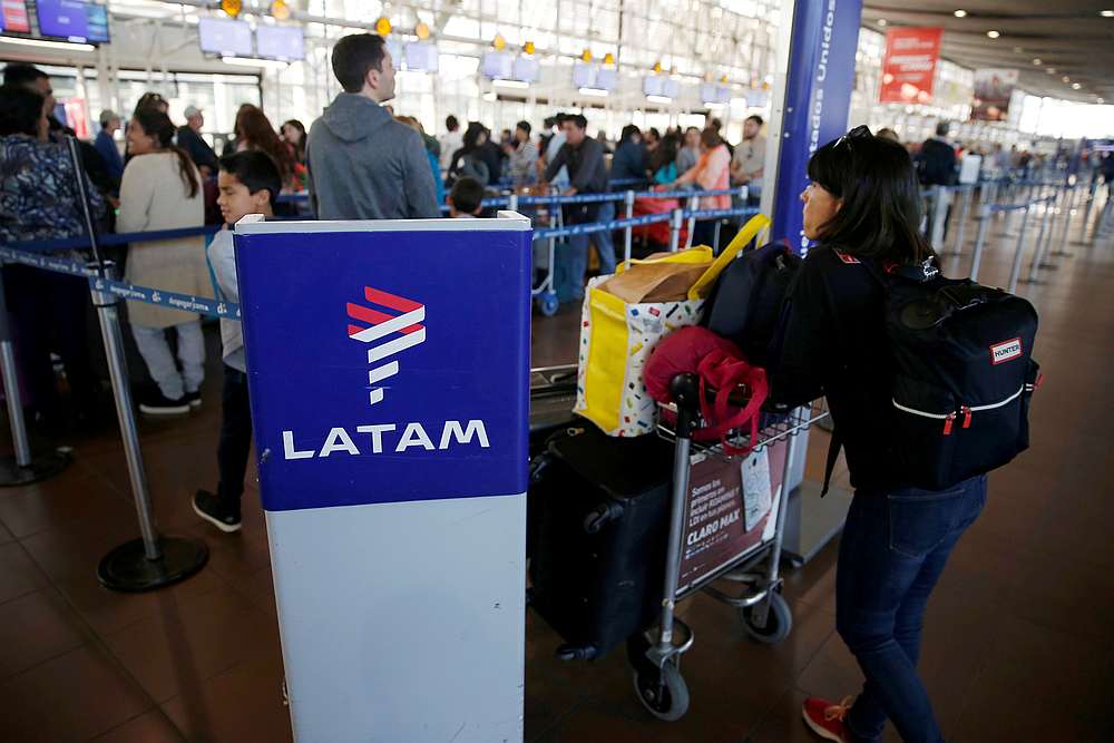 Passengers wait to check in for their flights at the departure area of Latam airlines inside of the Commodore Arturo Merino Benitez International Airport in Santiago, Chile April 25, 2019. u00e2u20acu201d Reuters pic