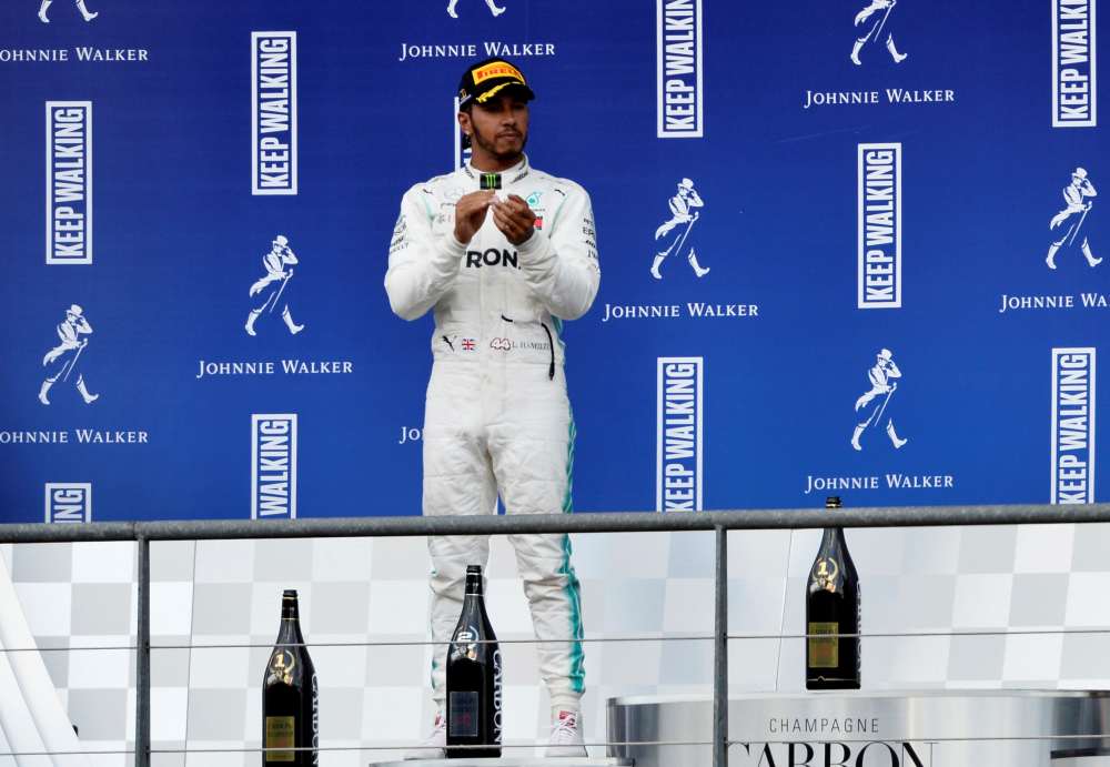Second placed Mercedes' Lewis Hamilton looks on from the podium after the Belgian Grand Prix, September 1, 2019. u00e2u20acu2022 Reuters pic