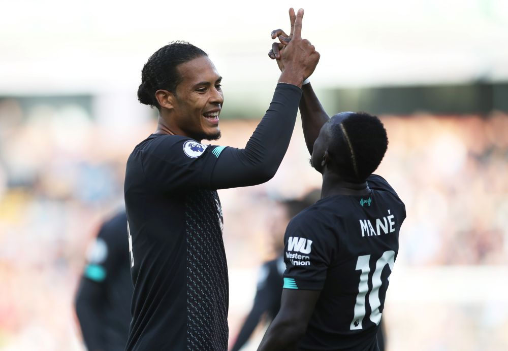 Liverpool's Sadio Mane celebrates scoring their second goal with Virgil van Dijk. u00e2u20acu201d Reuters pic