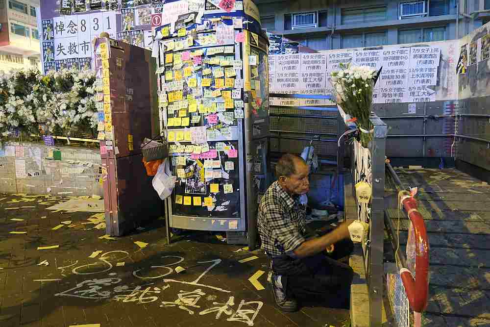 Lou Tit-Man, 73, reacts in front of a Lennon Wall outside Mong Kok police station in Hong Kong September 23, 2019. u00e2u20acu201d Reuters pic