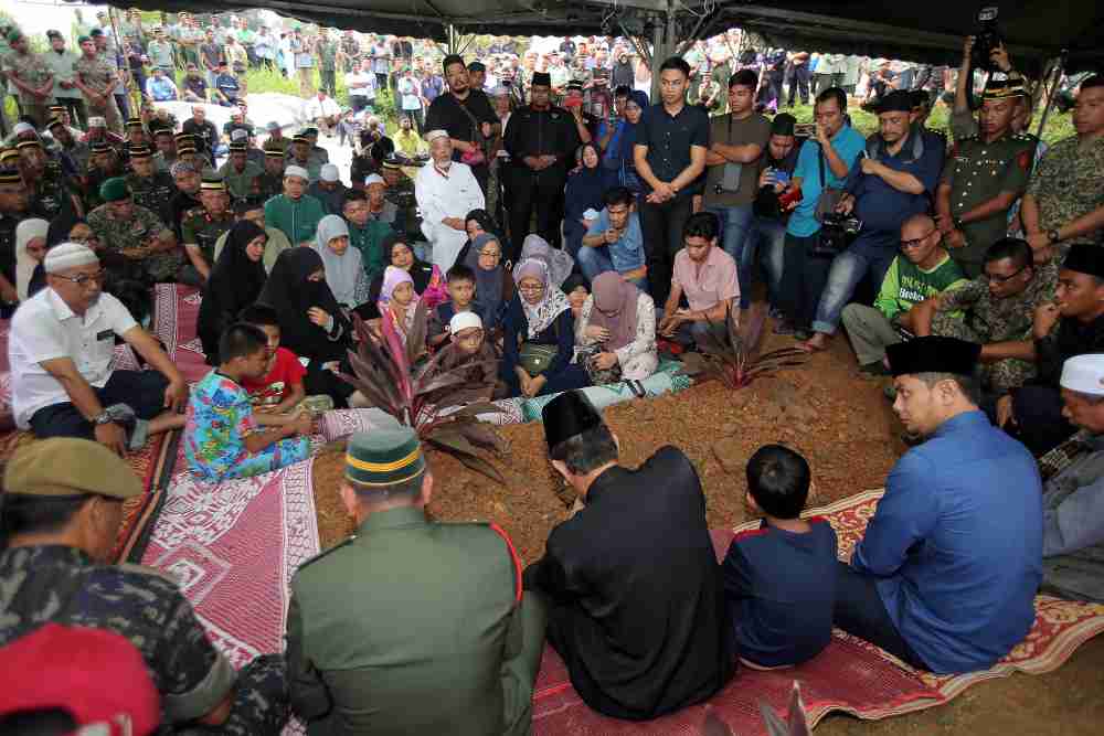 Over 1,000 people including family, relatives and military personnel attended the funeral of the late Major Mohd Zahir Armaya at Tanah Perkuburan Islam Tambun in Ipoh. u00e2u20acu2022 Picture by Farhan Najib