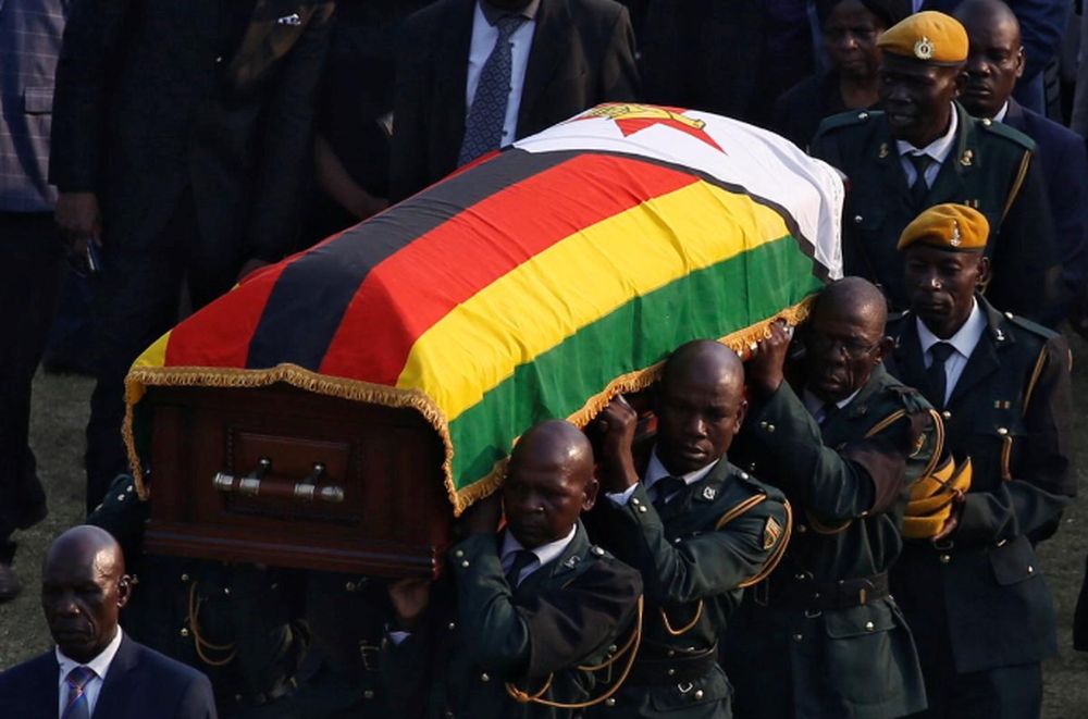 A casket carrying the remains of former Zimbabwean president Robert Mugabe is carried to the military chopper after his body lied in state at the Rufaro stadium, in Mbare, Harare, Zimbabwe, September 13, 2019. u00e2u20acu201d Reuters pic