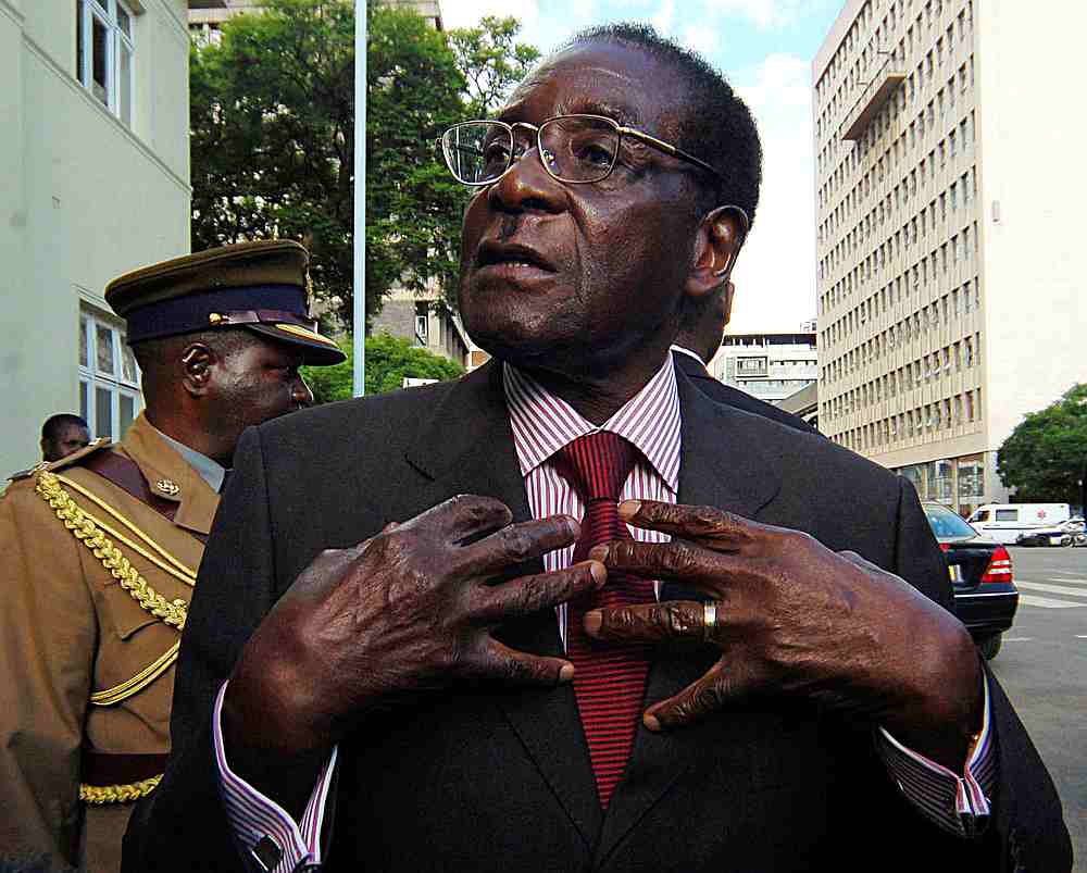 Zimbabwe's then-President Robert Mugabe speaks to journalists outside Parliament in Harare December 4, 2007. u00e2u20acu201d Reuters pic
