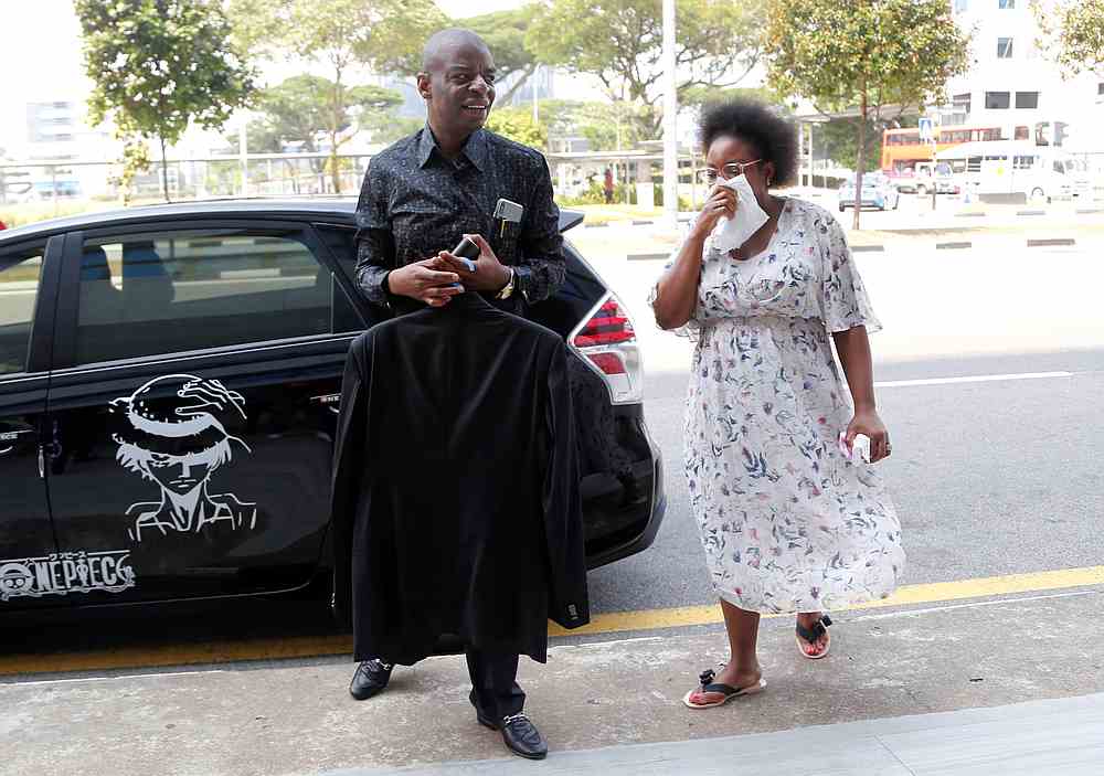 Adam Molai, son-in-law of Albert Mugabe, the late brother of Zimbabwe's former President Robert Mugabe, and a relative arrive at funeral parlour Singapore Casket in Singapore September 7, 2019. u00e2u20acu201d Reuters pic 