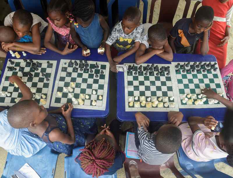 Children sit under a canopy as they play during a chess class at Ogolonto in Ikorodu district of Lagos. u00e2u20acu2022 AFP pic