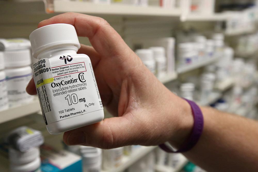 A pharmacist holds a bottle OxyContin made by Purdue Pharma at a pharmacy in Provo, Utah May 9, 2019. u00e2u20acu201d Reuters pic