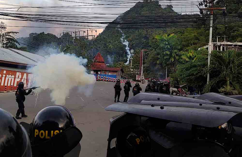 Riot police officers fire tear gas during a protest in Jayapura, Papua, Indonesia August 29, 2019. u00e2u20acu201d  Antara Foto/Indrayadi TH pic via Reuters 