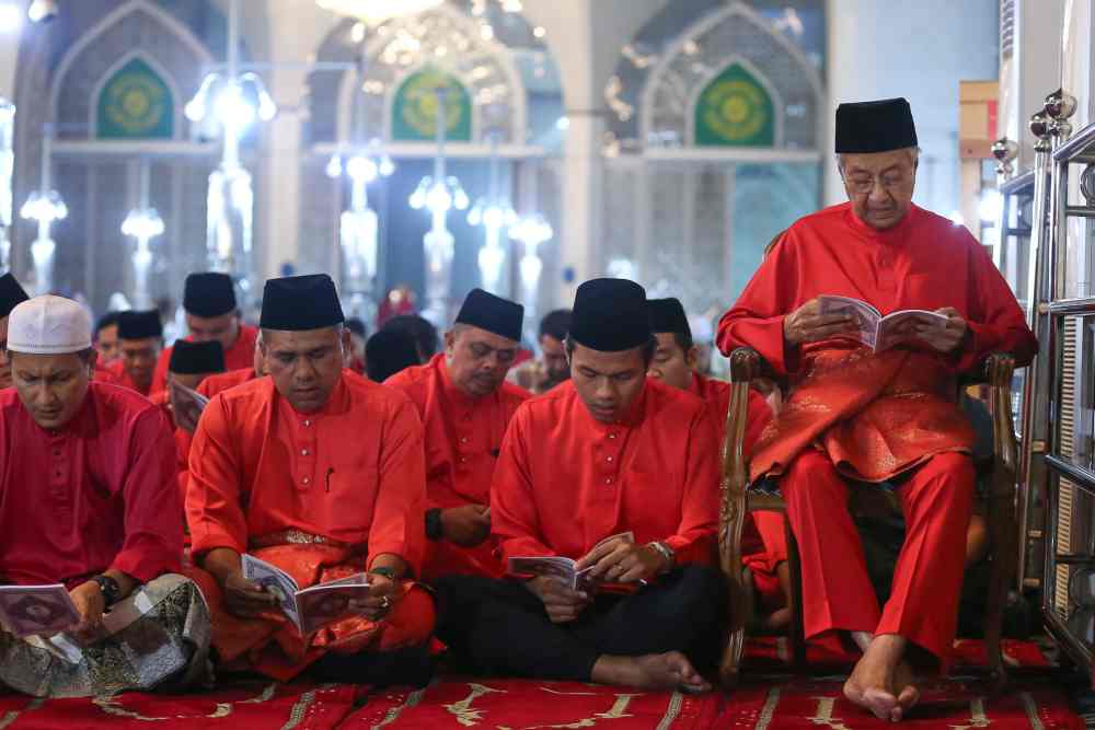 Tun Dr Mahathir Mohamad sits on a chair during the prayer and yasin recitation event commemmorating Parti Pribumi Bersatu Malaysia’s third anniversary, September 12, 2019.
