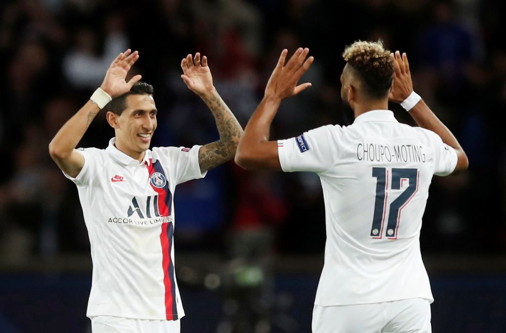 Paris St Germain's Angel Di Maria and Eric Maxim Choupo-Moting celebrate the win over Real Madrid at the Parc des Princes. u00e2u20acu201d Reuters picnn