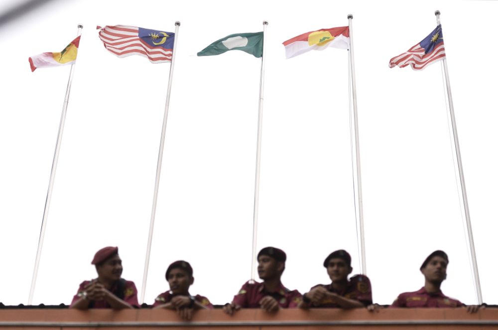PAS and Umno flags are pictured outside the Putra World Trade Centre in Kuala Lumpur September 13, 2019. u00e2u20acu201d Picture by Miera Zulyana
