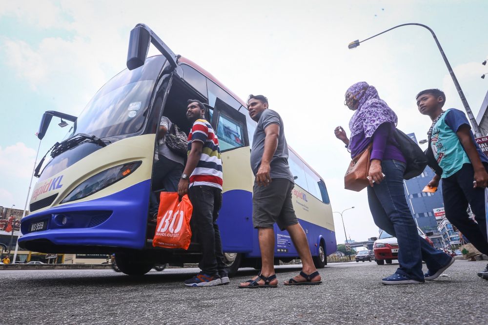People board a Rapid KL mini bus at Ampang Point September 3, 2019.  u00e2u20acu201d Picture by Hari Anggara