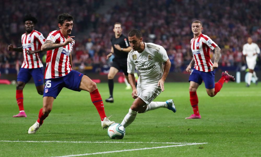 Real Madrid's Eden Hazard in action with Atletico Madrid's Stefan Savic. u00e2u20acu201d Reuters pic