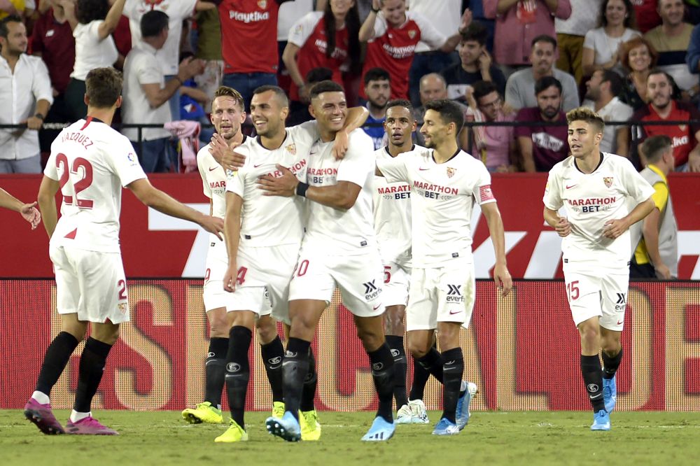 Sevilla's players celebrate after netting the winner against Real Sociedad at the Ramon Sanchez Pizjuan stadium in Seville on September 29, 2019. u00e2u20acu201d AFP pic
