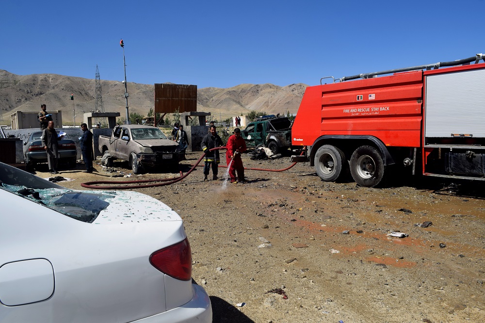 An Afghan firefighter sprays water on the ground at the site of a suicide attack that targeted a campaign rally for Afghan President Ashraf Ghani in Parwan Province on the outskirts of Kabul September 17, 2019. u00e2u20acu201d AFP pic      