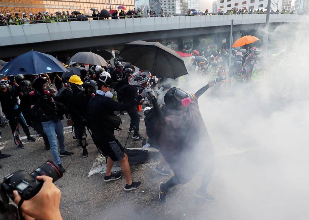 Anti-government protesters react after tear gas was fired during a demonstration near Central Government Complex in Hong Kong, China, September 15, 2019. u00e2u20acu201d Reuters pic