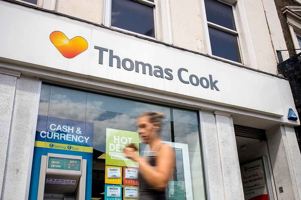 Pedestrians walk past a branch of a Thomas Cook travel agent's shop in London July 12, 2019. u00e2u20acu201d AFP pic