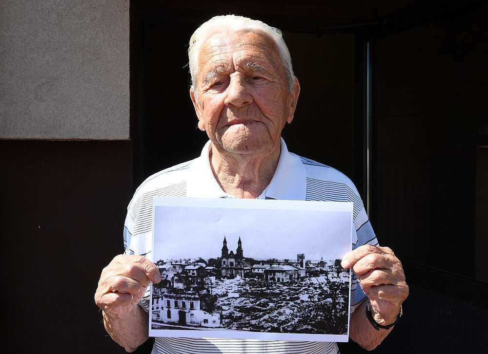 Tadeusz Sierandt, an eyewitness to the bombing of Wielun, holds a picture of the destroyed town on August 20, 2019.  u00e2u20acu201d AFP pic