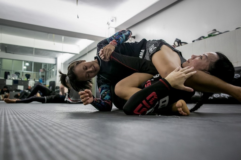 Myanmaru00e2u20acu2122s top woman fighter Bozhena Antoniyar (top) attends a training session in Yangon August 15, 2019. u00e2u20acu201d AFP pic