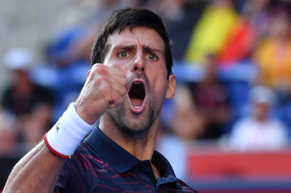 Serbiau00e2u20acu2122s Novak Djokovic reacts following a point against Belgiumu00e2u20acu2122s David Goffin in their menu00e2u20acu2122s singles semi-final match at the Japan Open in Tokyo October 5, 2019. u00e2u20acu201d AFP pic