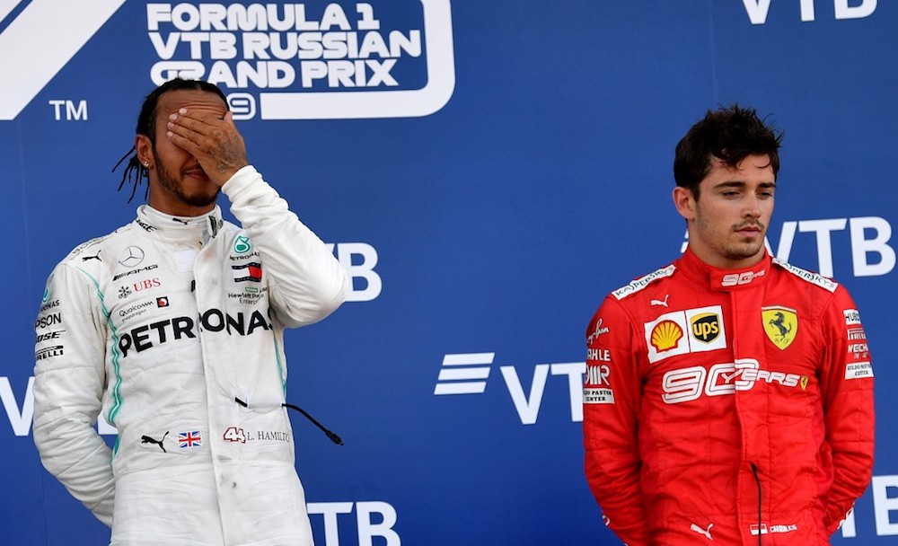 Winner Mercedesu00e2u20acu2122 Lewis Hamilton celebrates on the podium next to third-placed Ferrariu00e2u20acu2122s Monegasque driver Charles Leclerc after the Russian Grand Prix in Sochi September 29, 2019. u00e2u20acu201d AFP pic