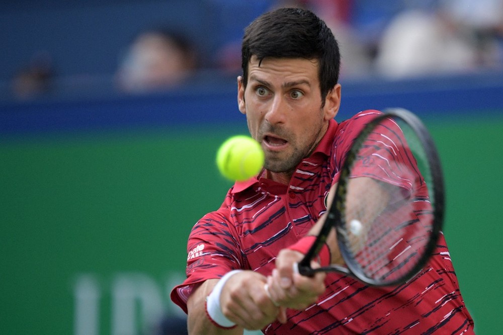 Novak Djokovic of Serbia hits a return during his menu00e2u20acu2122s singles third round match against John Isner of the US at the Shanghai Masters October 10, 2019. u00e2u20acu201d AFP pic