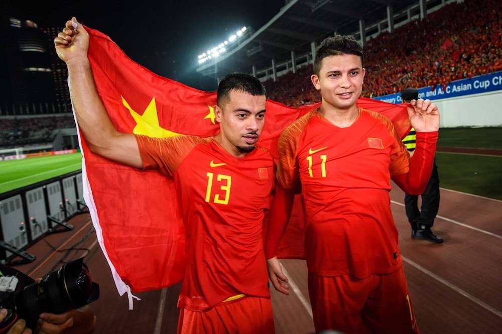 Chinau00e2u20acu2122s Li Ke and Elkeson celebrate after winning the 2022 Football World Cup qualifier with Guam in Guangzhou October 10, 2019. u00e2u20acu201d AFP pic
