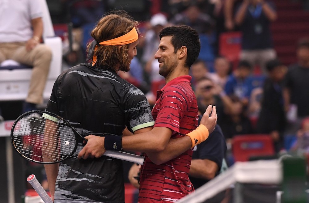 Stefanos Tsitsipas of Greece speaks with Novak Djokovic of Serbia after winning their menu00e2u20acu2122s singles quarter-final match at the Shanghai Masters October 11, 2019. u00e2u20acu201d AFP pic