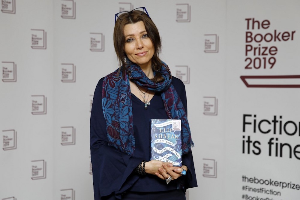 Turkish-British author Elif Shafak poses with her book u00e2u20acu02dc10 Minutes 38 Seconds in This Strange Worldu00e2u20acu2122 during the photo call for the authors shortlisted for the 2019 Booker Prize for Fiction in London October 13, 2019. u00e2u20acu201d AFP pic