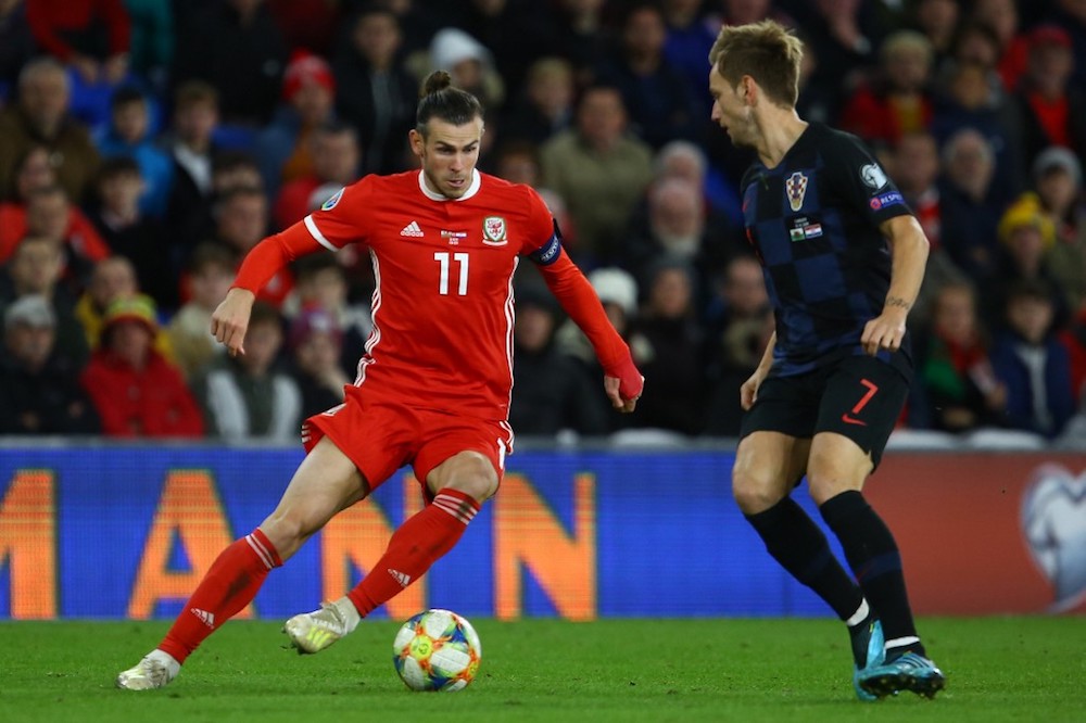 Walesu00e2u20acu2122 Gareth Bale vies with Croatiau00e2u20acu2122s midfielder Ivan Rakitic during the Euro 2020 qualification match at Cardiff City Stadium, Cardiff October 13, 2019. u00e2u20acu201d AFP pic