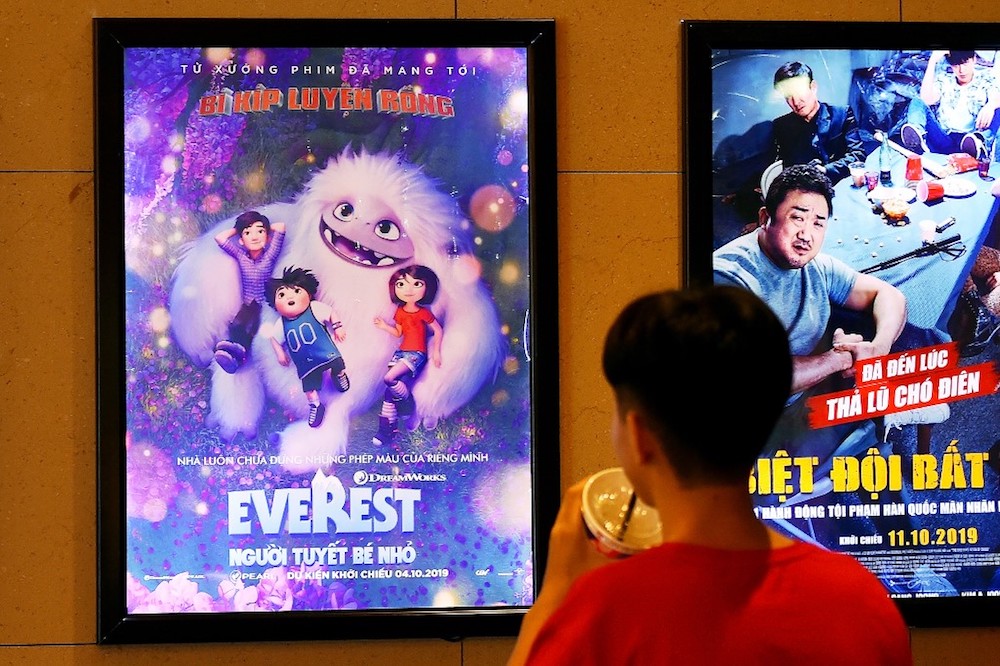 A boy looks at a poster for the animated movie u00e2u20acu02dcAbominableu00e2u20acu2122, also known as u00e2u20acu02dcEverestu00e2u20acu2122, at a cinema in Hanoi October 14, 2019. u00e2u20acu201d AFP pic