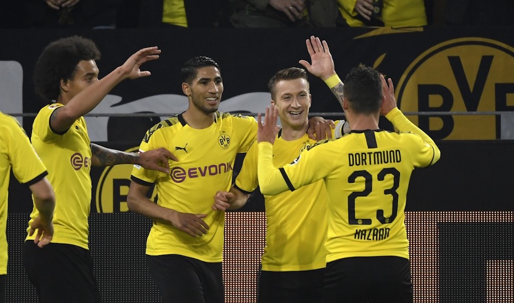 Dortmundu00e2u20acu2122s Axel Witsel, Achraf Hakimi, Marco Reus and Thorgan Hazard celebrate a goal during the Bundesliga match with Borussia Moenchengladbach in Dortmund October 19, 2019. u00e2u20acu201d AFP pic