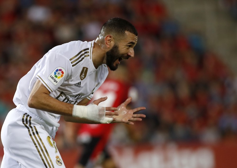 Real Madridu00e2u20acu2122s Karim Benzema reacts to missing a goal opportunity during the La Liga match with Mallorca at the Iberostar estadi stadium in Palma de Mallorca October 19, 2019. u00e2u20acu201d AFP pic