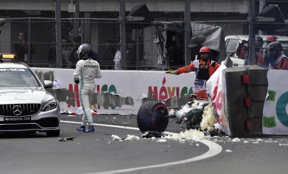 Mercedes Benzu00e2u20acu2122s Valtteri Bottas (left) leaves the racing track after crashing his car during the qualifying session of the Mexico Grand Prix at the Hermanos Rodriguez circuit in Mexico City October 26, 2019. u00e2u20acu201d AFP pic