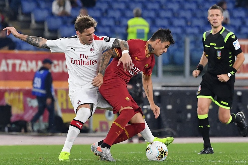 AS Romau00e2u20acu2122s Diego Perotti vies with AC Milanu00e2u20acu2122s Lucas Biglia during the Serie A match at the Olympic stadium in Rome October 27, 2019. u00e2u20acu201d AFP pic