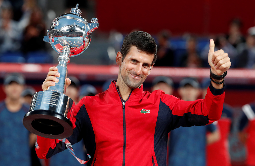 Novak Djokovic of Serbia celebrates with the trophy after winning the Japan Open, October 6, 2019. u00e2u20acu201d Reuters pic