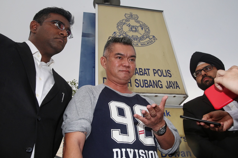 Koh Tat Meng with his lawyers Rajesh Nagarajan (left) and Sachpreetraj Singh Sohanpal after filing a police report at Balai Polis USJ 8, October 8, 2019. u00e2u20acu201d Picture by Choo Choy May
