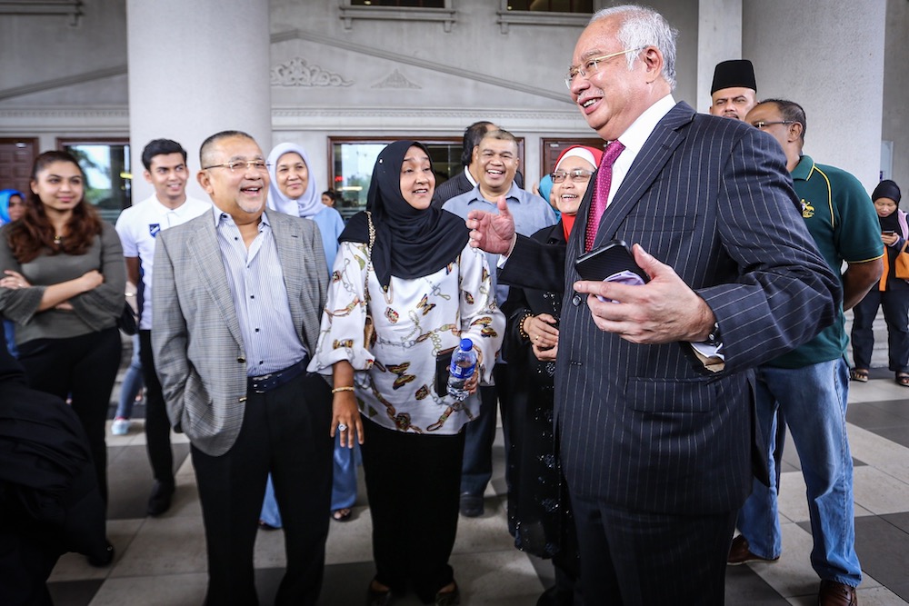 Former Prime Minister Datuk Seri Najib Tun Razak is seen with former Felda chairman Tan Sri Mohd Isa Abdul Samad (left) at the Kuala Lumpur Court Complex, October 8, 2019. u00e2u20acu201d Picture by Hari Anggara
