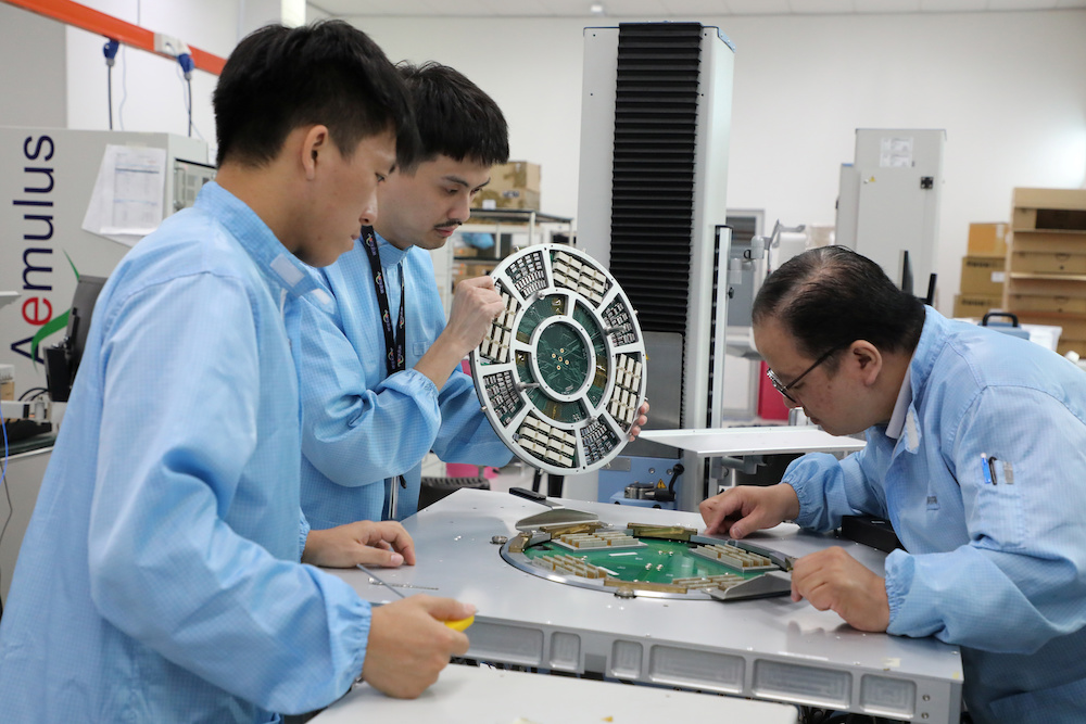 Employees of the automated test equipment designer and solutions provider Aemulus Holdings Berhad work at a production facility in Penang September 20, 2019. u00e2u20acu201d Reuters pic