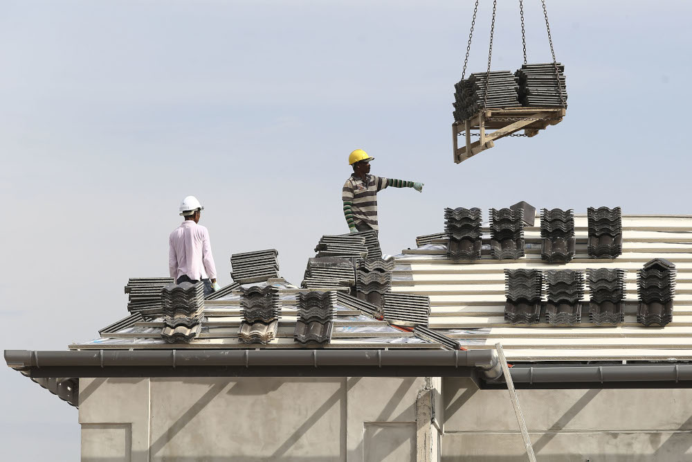 Foreign workers work at residential area which is under construction at Puncak Alam in Selangor November 1, 2018. u00e2u20acu201d Picture by Yusof Mat Isa