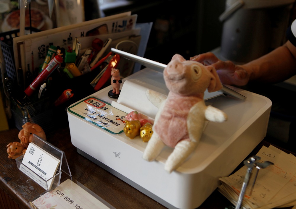nA female staffer types sales data into an iPad-style cash register, with a notice circled in red that reads u00e2u20acu02dctax excludedu00e2u20acu2122, at Fri-tei restaurant in Tokyo September 20, 2019. u00e2u20acu201d Reuters picn
