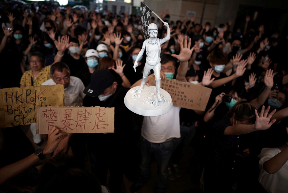 A figurine of a Hong Kong anti-government protester is held up as people gather at West Kowloon Law Courts Building to show their support to 96 anti-government protesters who were arrested days ago in Hong Kong October 2, 2019. u00e2u20acu201d Reuters pic